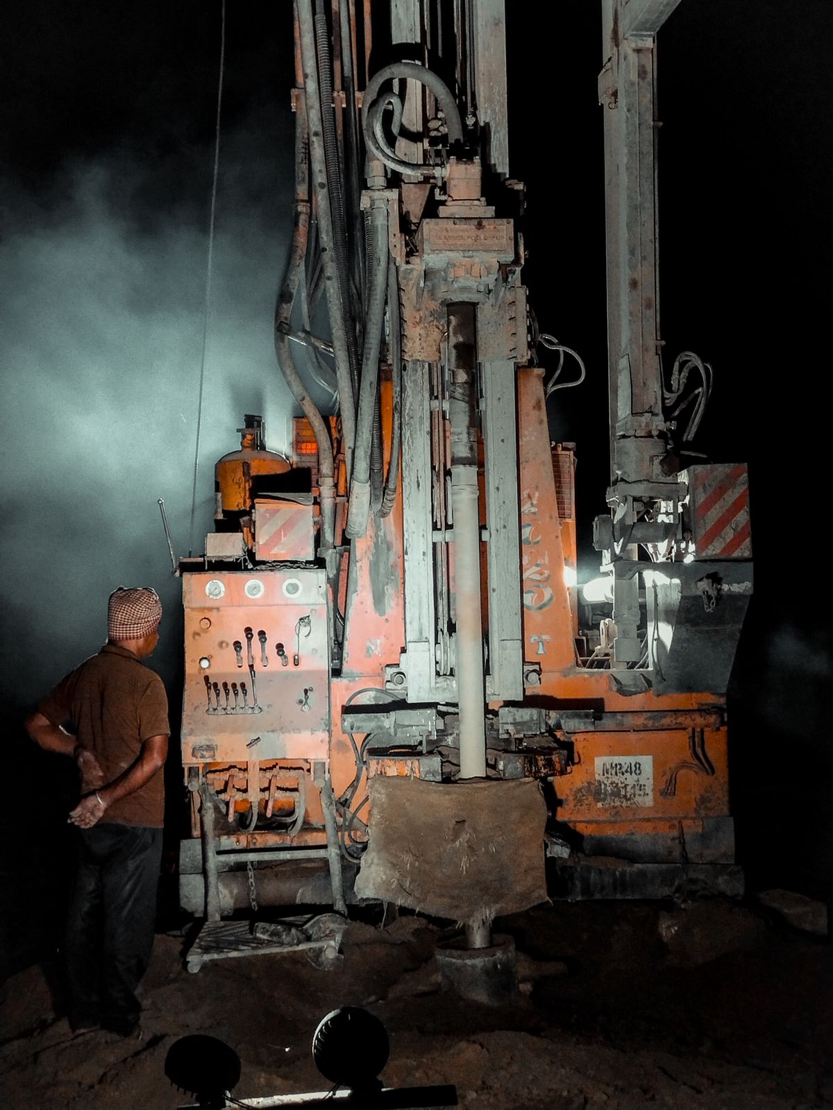 Borehole drilling rig operating at night — Durban, KwaZulu-Natal